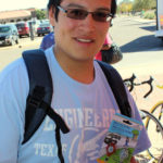 Texas Tech Student shows off bike lights at Graduate School bike clinic