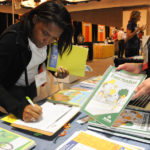 A teacher checks out BikeTexas resources at the TAHPERD convention.