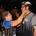 BikeTexas' Allene Mayfield adjusts a helmet for a ride participant